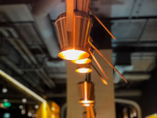 light bulb coffee pots on the ceiling in bar close-up. Lighting design. Interior design
