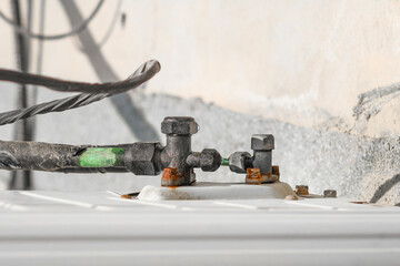 humid leaking pipe of a central air conditioning system and cold water drops on it