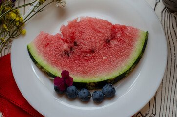 watermelon slices on a white plate