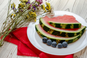 watermelon slices on a white plate