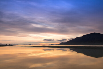 Fototapeta premium Sunset in the arctic with reflections in the water on Spitsbergen