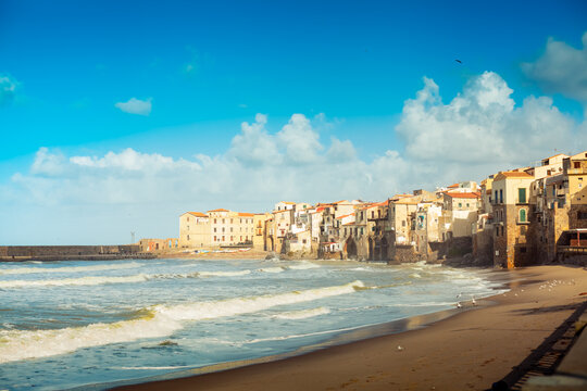 View to Cefalu old town from the beach, Sicily, Italy