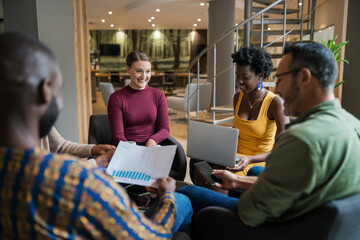 Diverse businesspeople discussing work during an office meeting - Powered by Adobe