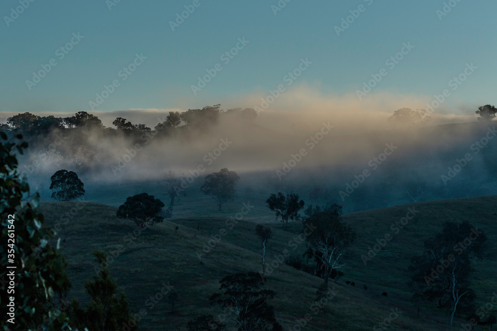 Wall mural Fog rolling in on Gigerline Nature Reserve