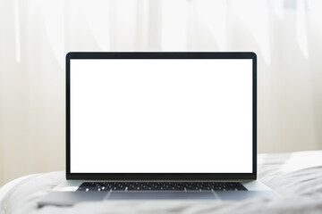 Mock up Blank screen laptop on the bed for advertising and text.
