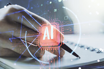 Double exposure of creative artificial Intelligence abbreviation with man hand writing in notepad...