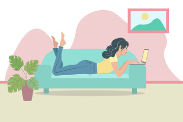 the girl is lying on the sofa with a laptop