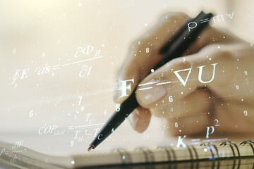 Creative scientific formula hologram with woman hand writing in notepad on background, research...