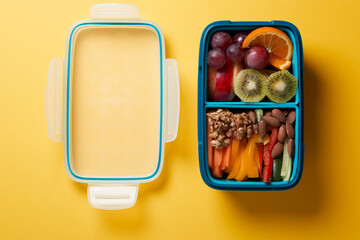 Top View of Full Lunch Box with Fuits, Vegetables and nuts.