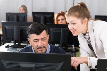 Middle aged man listening female coach
