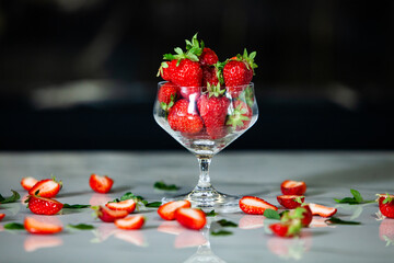 glass bowl with fresh strawberries isolated. Strawberry juice.  