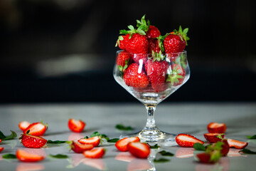glass bowl with fresh strawberries isolated. Strawberry juice.  