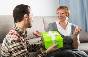 Son giving present to mother