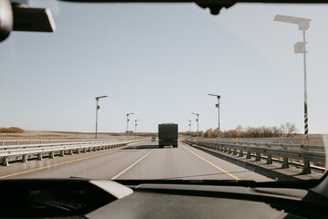 view through the windshield of a car on a summer day