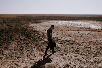 the man from the back in empty steppe