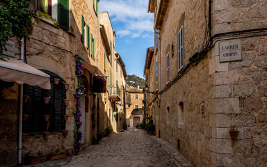 mediterranean romantic narrow alley called carrer chopin illuminated from sunlight in the small village valldemossa
