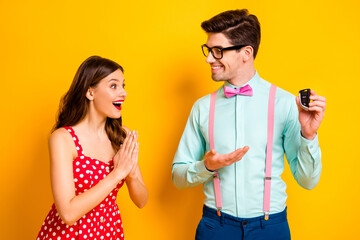 Dear its for you.Two people amazed girl geek nerd man give her car present on valentine day...