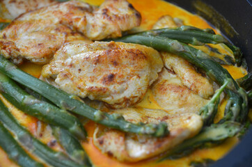 Chicken in a creamy sauce with asparagus