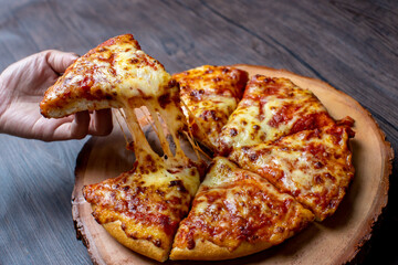 pizza on a wooden plate