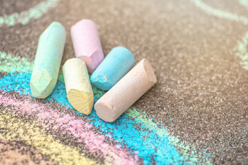 Sidewalk chalks close-up.  rainbow chalk painting. Summer outdoor activity for children idea. © Katerina Schneider