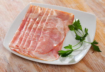 Fototapeta premium Image of traditional Spanish tapas - sliced jamon
