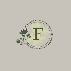 Circle nature tree F letter logo with green leaves in circle line shape for Initial business style with botanical leaf elements vector design.