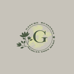 Circle nature tree G letter logo with green leaves in circle line shape for Initial business style with botanical leaf elements vector design.