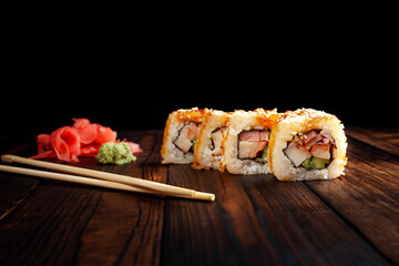 Japan sushi rolls isolated on black background