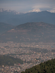 Fototapeta na wymiar Pokhara, Nepal. Vertical shot of Himalaya range and Pokhara from Peace Stupa.