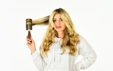 Curling Your Hair Much Easier. Hot curling brush. Pretty woman brushing hair isolated on white background. Long hair. Hair care. Hairdresser salon. Professional equipment. Beauty supplies shop