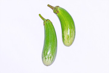 Fresh long green brinjal,thai green eggplant or aubergine on white background.