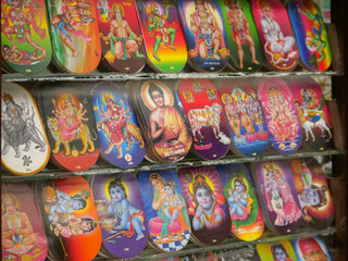 Fototapeta na wymiar Kathmandu, Nepal. 12/1/2020. Hindu and buddhists stickers in a shop.