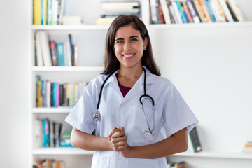 Portrait of laughing mexican nurse or medical student