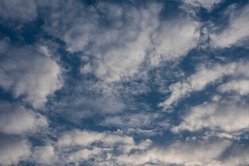 Beautiful clouds roaming in the red and bluish sky during sunset in the afternoon. Indian landscape and sky.