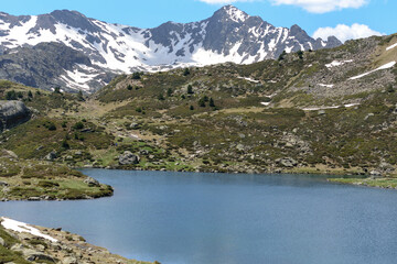 Fototapeta na wymiar Beautiful view hiking in the Andorra Pyrenees Mountains in Ordino, near the Lakes of Tristaina