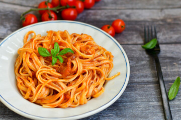  Close up of  home made spaghetti bolognese  with tomato sauce from cherry tomatoes  and basil