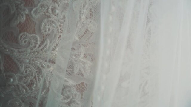 details of the bride in the wedding dress