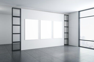 Contemporary gallery interior with three blank posters