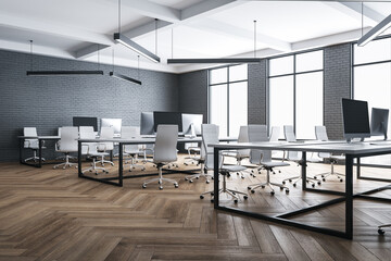 Contemporary office interior with computers on desk.