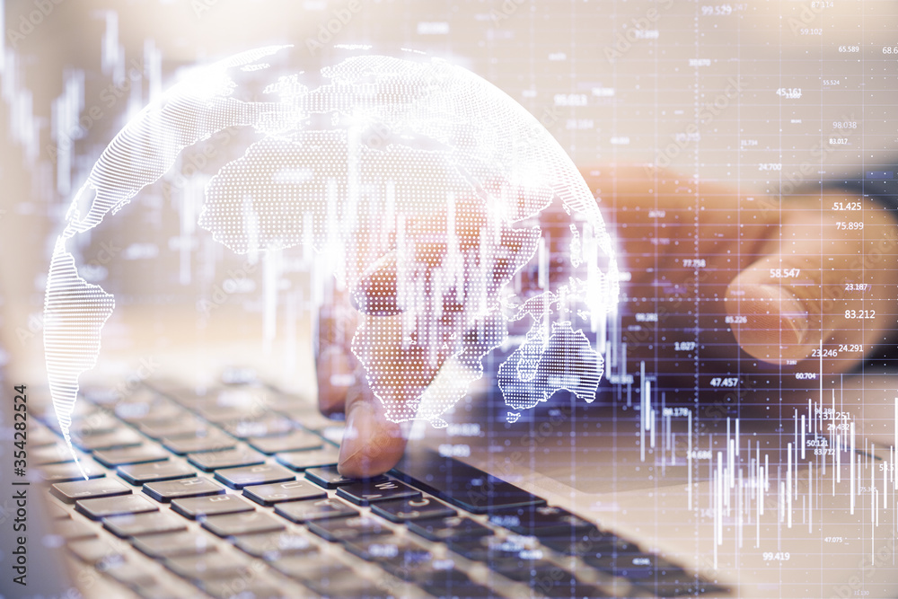 Poster hand typing on laptop and candlestick chart of falling stock