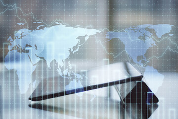 Digital tablet and crash chart with digital earth hologram.