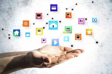 Hand holding glowing online networking cloud icons