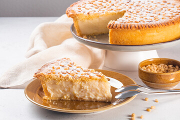 Italian Grandma's cake - Torta della nonna.  Pine nut custard tart from Tuscany, Italy. Copy space.