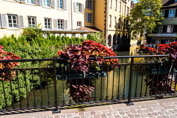 The streets of Colmar in Alsace, France include a navigable canal through the city center