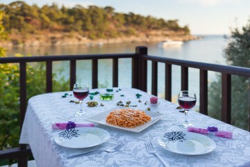 Fototapeta premium Dinner decoration with spaghetti on menu in a restaurant terrace