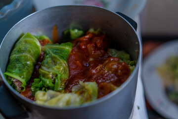 Cooking stuffed cabbage. Making minced meat in cabbage leaves.