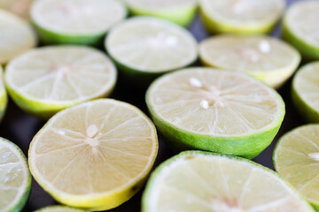 Lemon cut in half to prepare for cooking. Lime is a citrus fruit that is popularly used in Thai recipes.