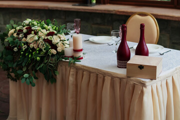 Decorations on the wedding table in a rustic style.