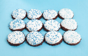 Blue marshmallows made from apple molasses with coconut on a blue background. Natural traditional dessert, sweet food