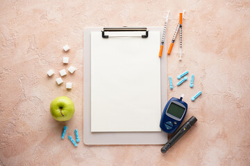 Digital glucometer, lancet pen, apple and syringes on a beige background, flat lay. Diabetes concept. Blood glucose meter.